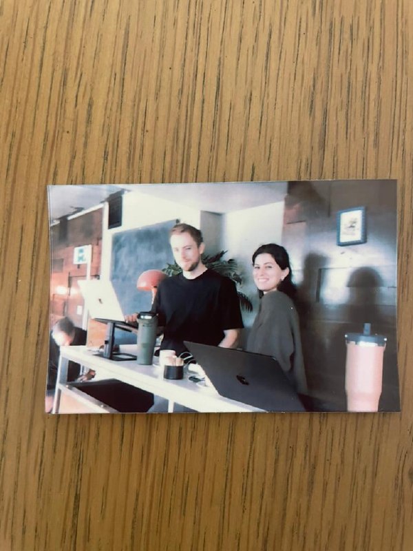 A printed photo of the two of us at our desks