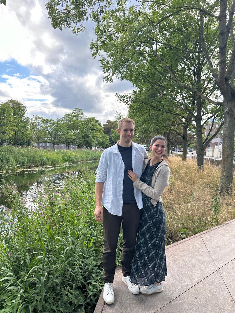 Olivia and Blaine beside a leafy Dublin canal
