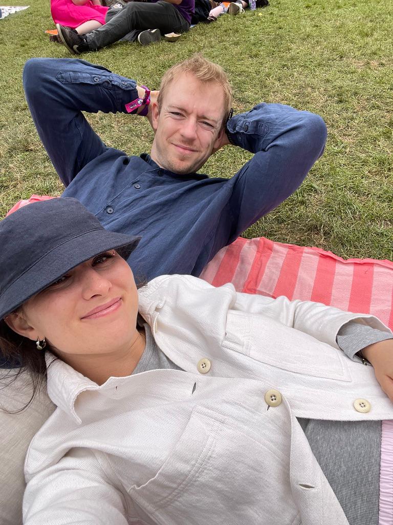 Lounging on a picnic blanket at a festival
