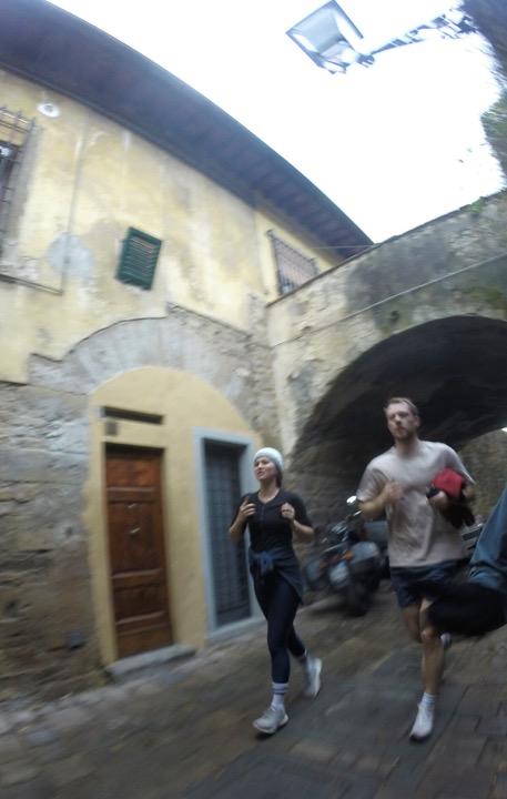 Running through an old stone archway