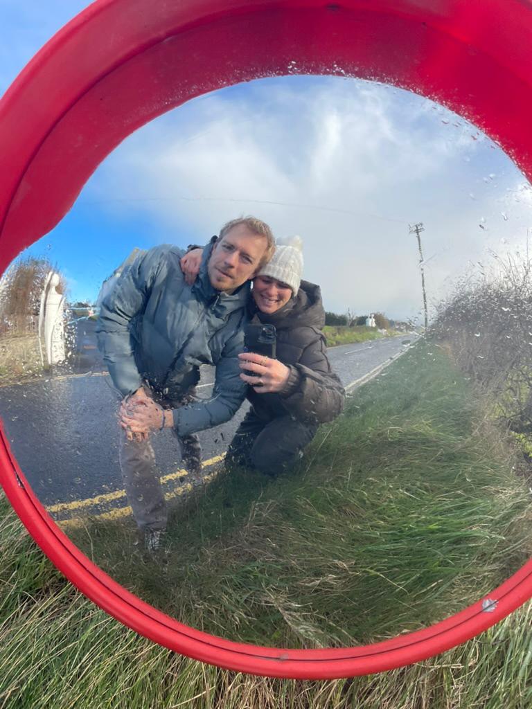 The two of us, reflected in a roadside convex mirror